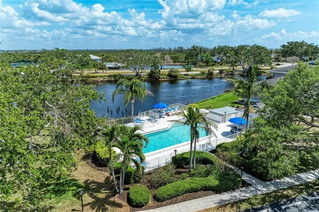 a dining room with furniture and a book shelf