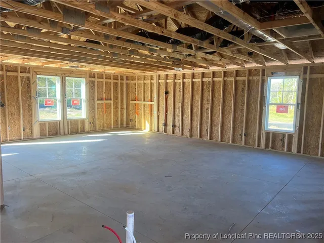 a view of an empty room with windows