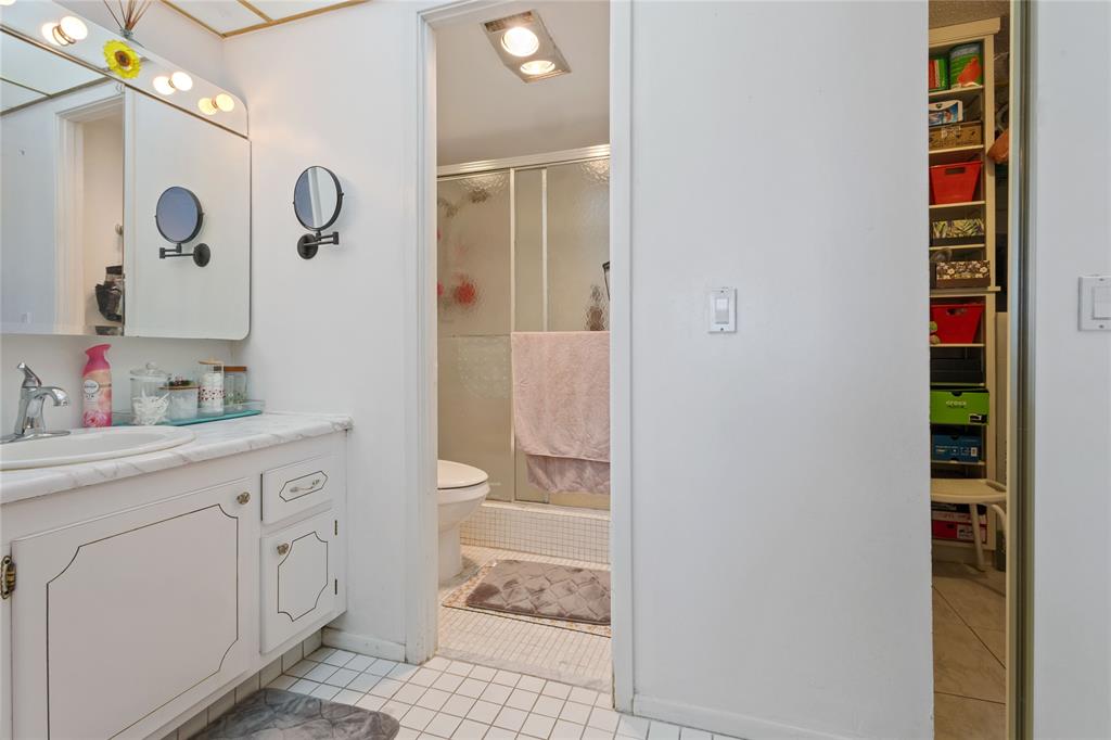 200 Diplomat Parkway, Unit 520 Hallandale Beach, FL 33009 - Photo 11 of 17 a spacious bathroom with a shower and a sink