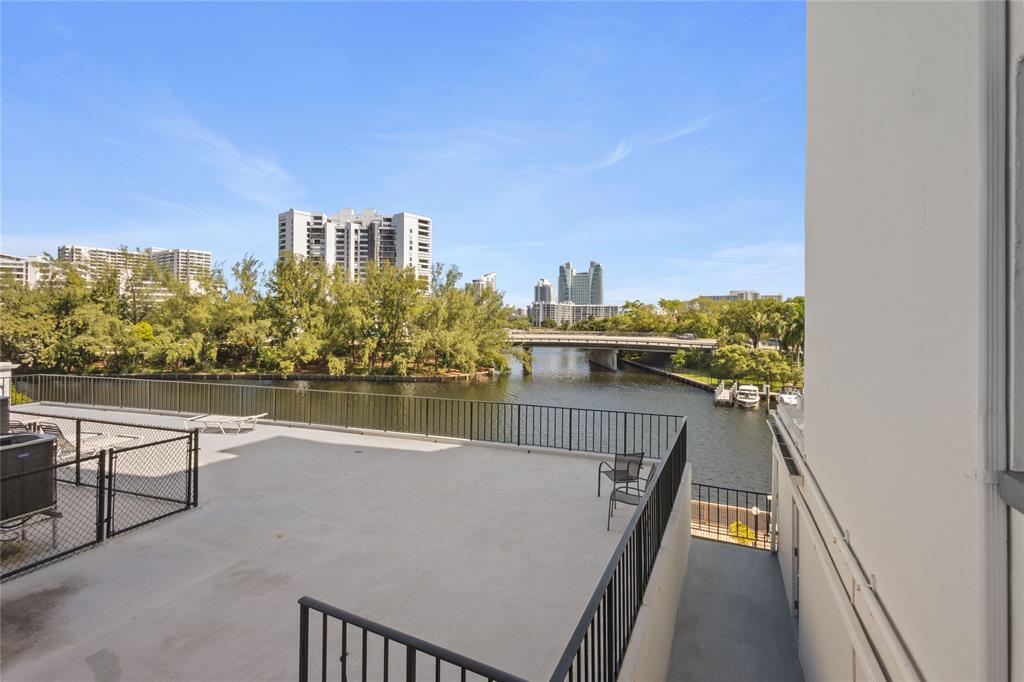 200 Diplomat Parkway, Unit 520 Hallandale Beach, FL 33009 - Photo 15 of 17 a view of a balcony with two chairs