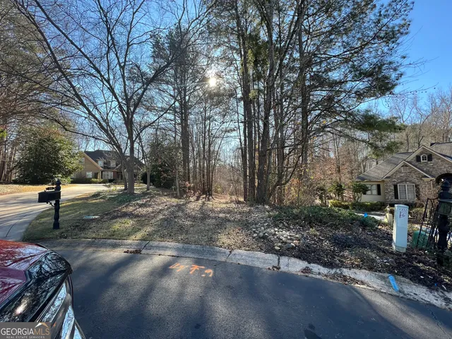 a view of a yard with trees