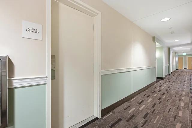 a view of a refrigerator in kitchen and wooden floor