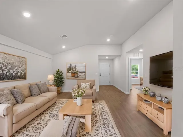 a bed room with a bed and a potted plant