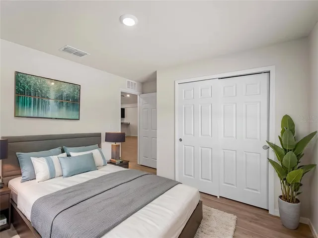 a kitchen with a refrigerator and a sink