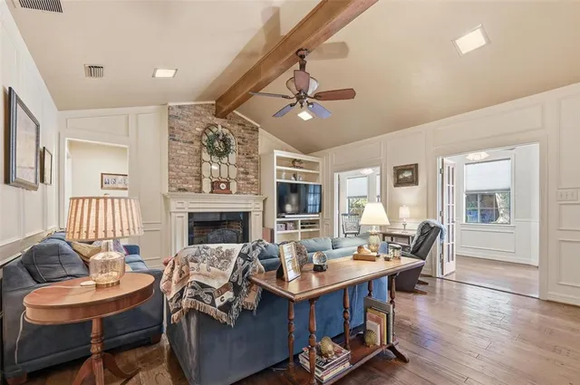 a view of a livingroom with furniture window and wooden floor