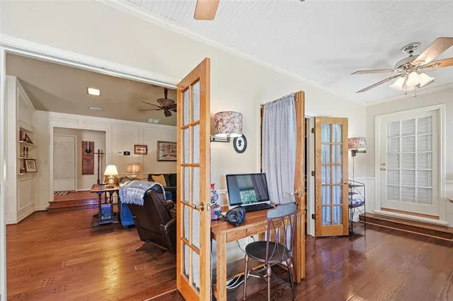 a view of a livingroom with furniture and a flat screen tv