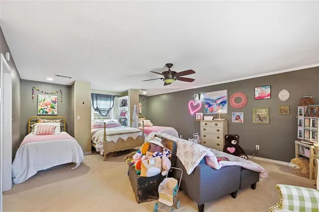 a bedroom with furniture and a flat screen tv