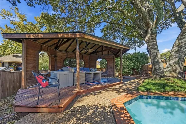 a view of swimming pool with a patio