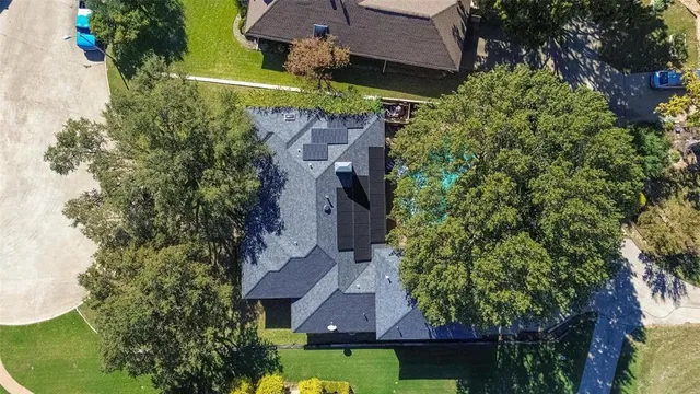 an aerial view of house with yard swimming pool and outdoor seating