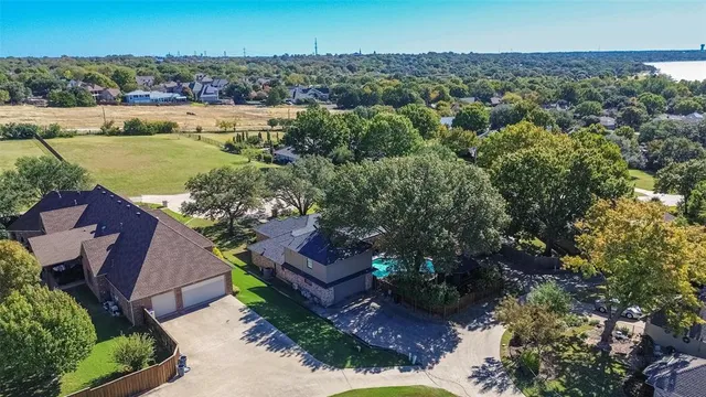 an aerial view of a house with a garden