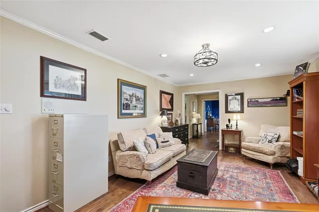 a living room with furniture and a rug