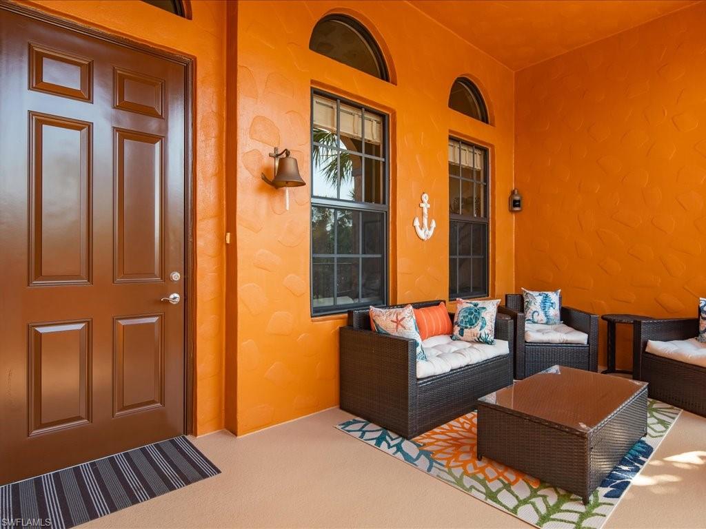 8985 Cambria Circle, Unit 215 Naples, FL 34113 - Photo 2 of 36 a outdoor space with patio furniture