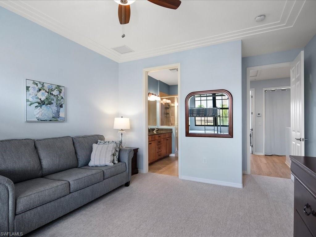 8985 Cambria Circle, Unit 215 Naples, FL 34113 - Photo 24 of 36 a living room with furniture and a view of bathroom
