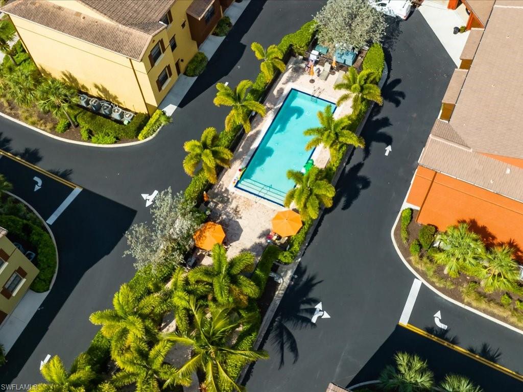 8985 Cambria Circle, Unit 215 Naples, FL 34113 - Photo 31 of 36 view of a house with a yard