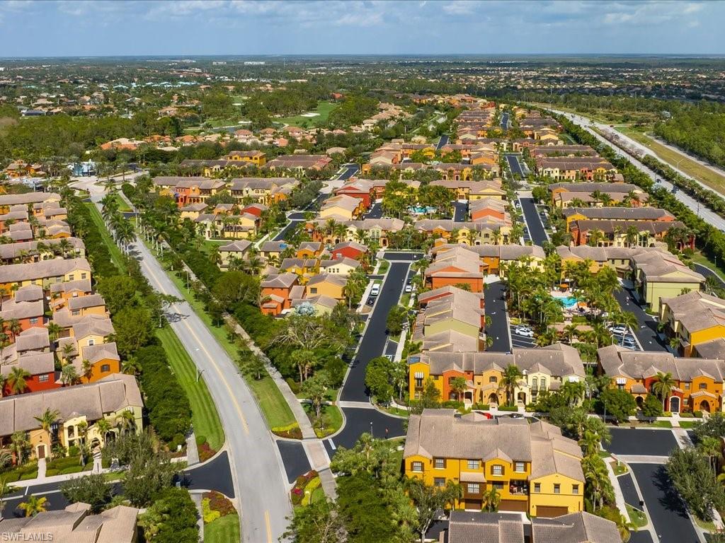 8985 Cambria Circle, Unit 215 Naples, FL 34113 - Photo 35 of 36 an aerial view of residential building and lake
