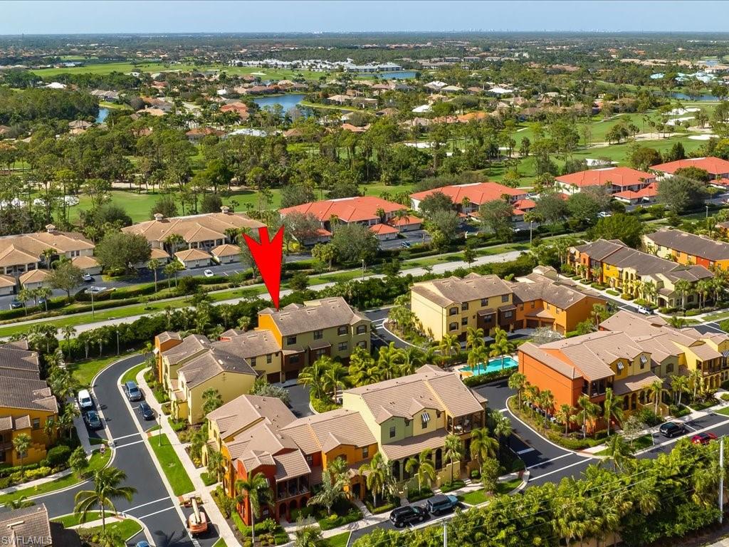 8985 Cambria Circle, Unit 215 Naples, FL 34113 - Photo 4 of 36 an aerial view of residential houses with outdoor space