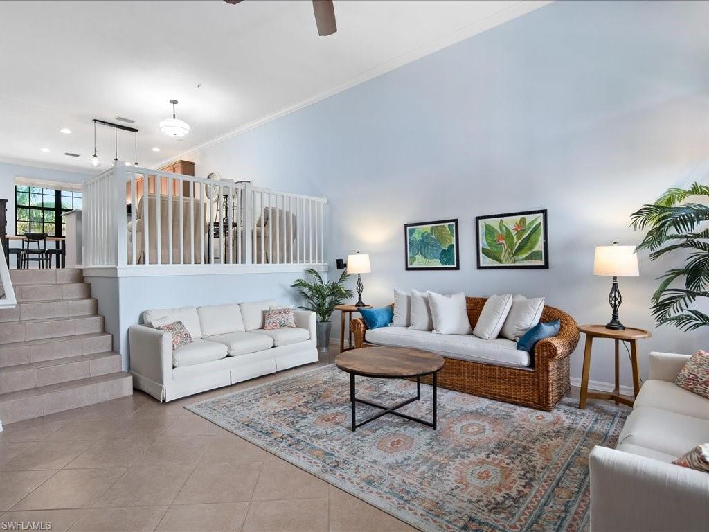 8985 Cambria Circle, Unit 215 Naples, FL 34113 - Photo 5 of 36 a living room with furniture and a couch