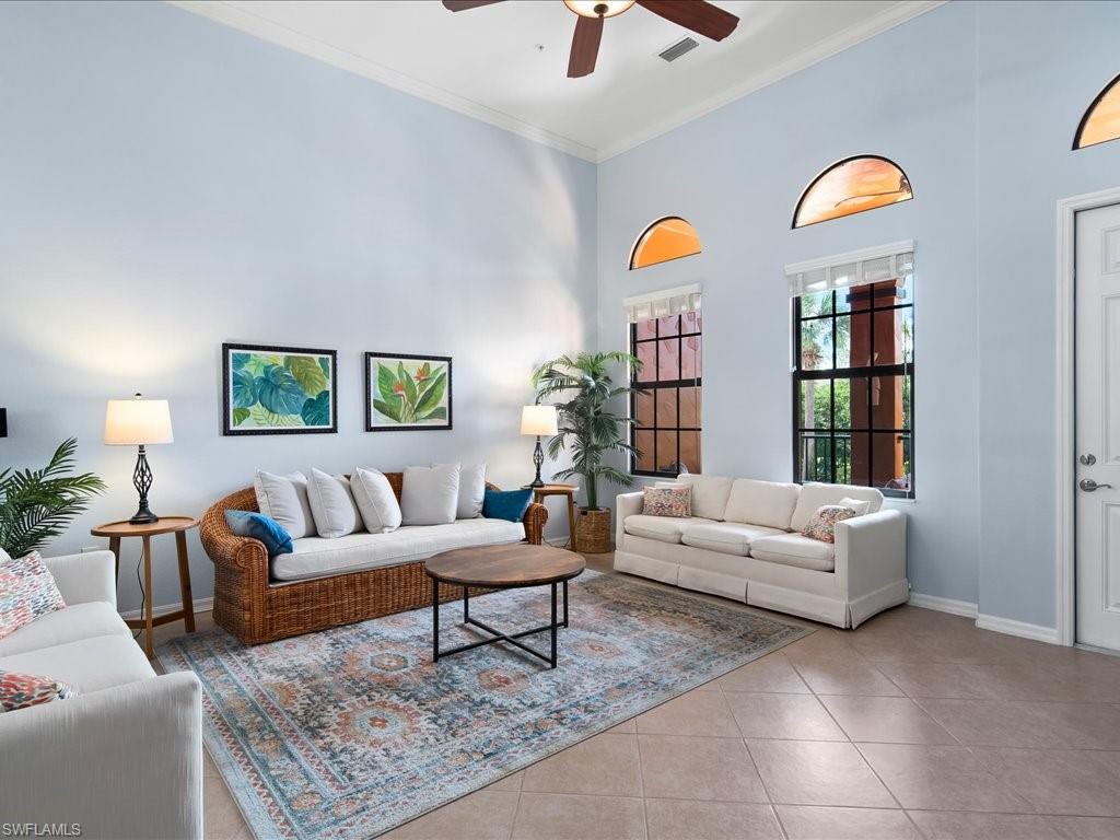 8985 Cambria Circle, Unit 215 Naples, FL 34113 - Photo 6 of 36 a living room with furniture and a window