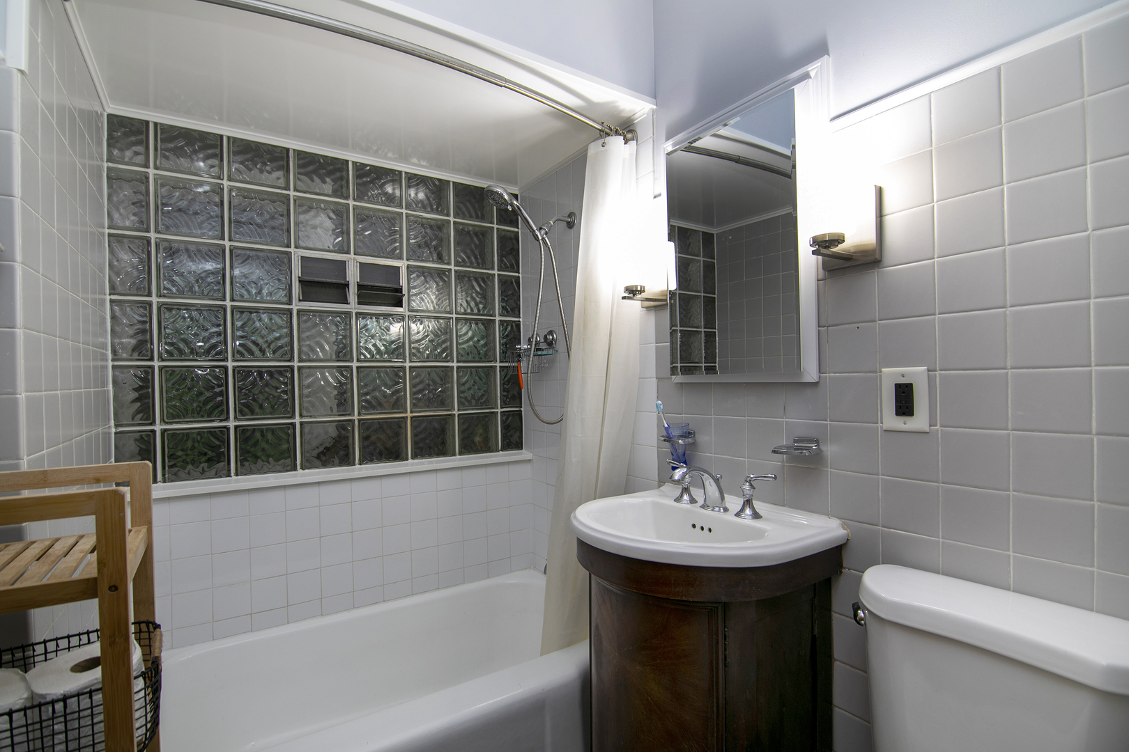 2444 183rd Street Homewood, IL 60430 - Photo 14 of 25 a bathroom with a sink a toilet and shower