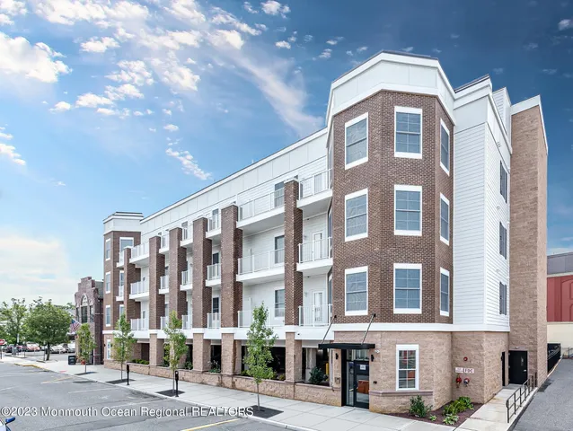 a front view of a building with street view