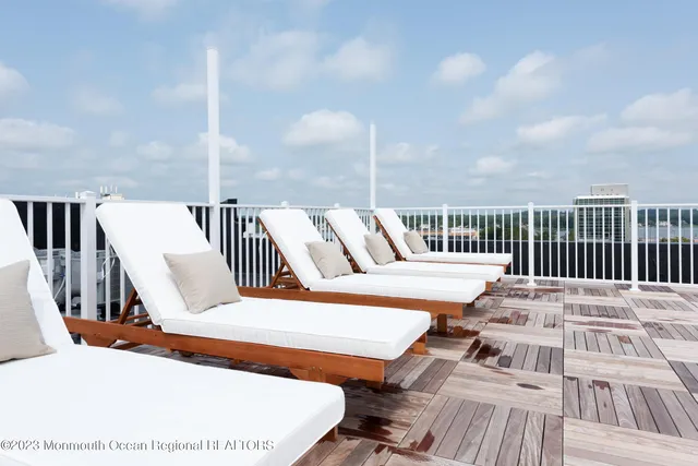 a view of roof deck with patio