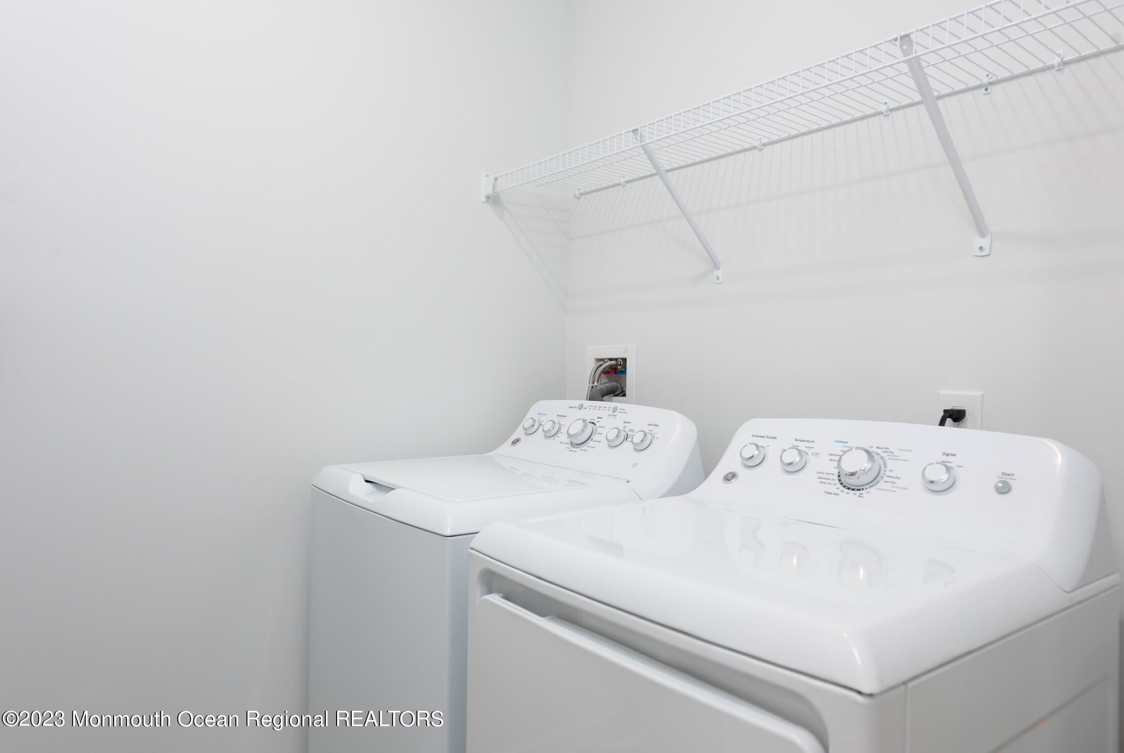 24 Mechanic Street, Unit 208 Red Bank, NJ 07701 - Photo 7 of 17 a utility room with dryer and washer
