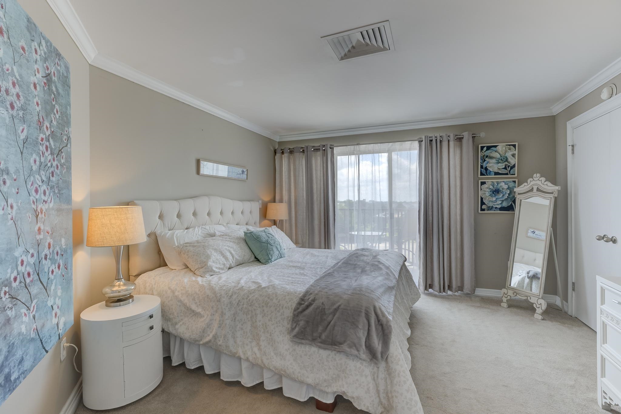 655 Riverside Drive, Unit 506B Memphis, TN 38103 - Photo 17 of 26 a bed room with a bed and a chair