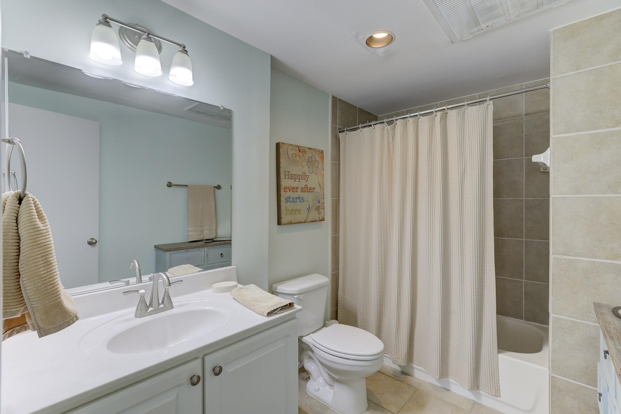 655 Riverside Drive, Unit 506B Memphis, TN 38103 - Photo 18 of 26 a bathroom with a sink toilet and shower