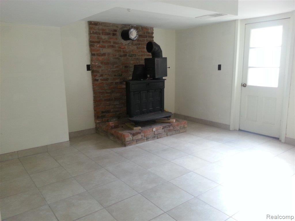 170 Myers Road Lapeer, MI 48446 - Photo 20 of 23 170 Myers woodburner.jpg