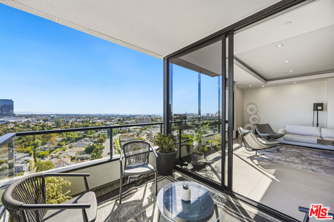 10350 Wilshire Boulevard, Unit 1203 Los Angeles, CA 90024 - Photo 13 of 69 a very nice looking dining room with a large window and kitchen view