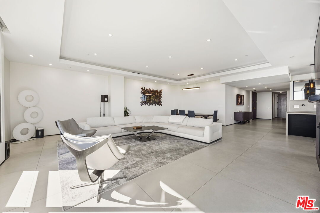 10350 Wilshire Boulevard, Unit 1203 Los Angeles, CA 90024 - Photo 14 of 69 a living room with furniture and a couch