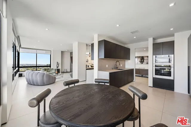 a bed room with a bed and a large window