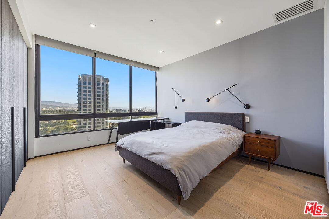 10350 Wilshire Boulevard, Unit 1203 Los Angeles, CA 90024 - Photo 28 of 69 a bed room with a bed and a large window