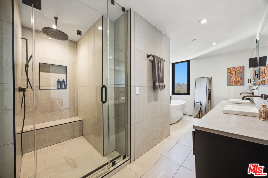 10350 Wilshire Boulevard, Unit 1203 Los Angeles, CA 90024 - Photo 35 of 69 a bathroom with a sink and a mirror