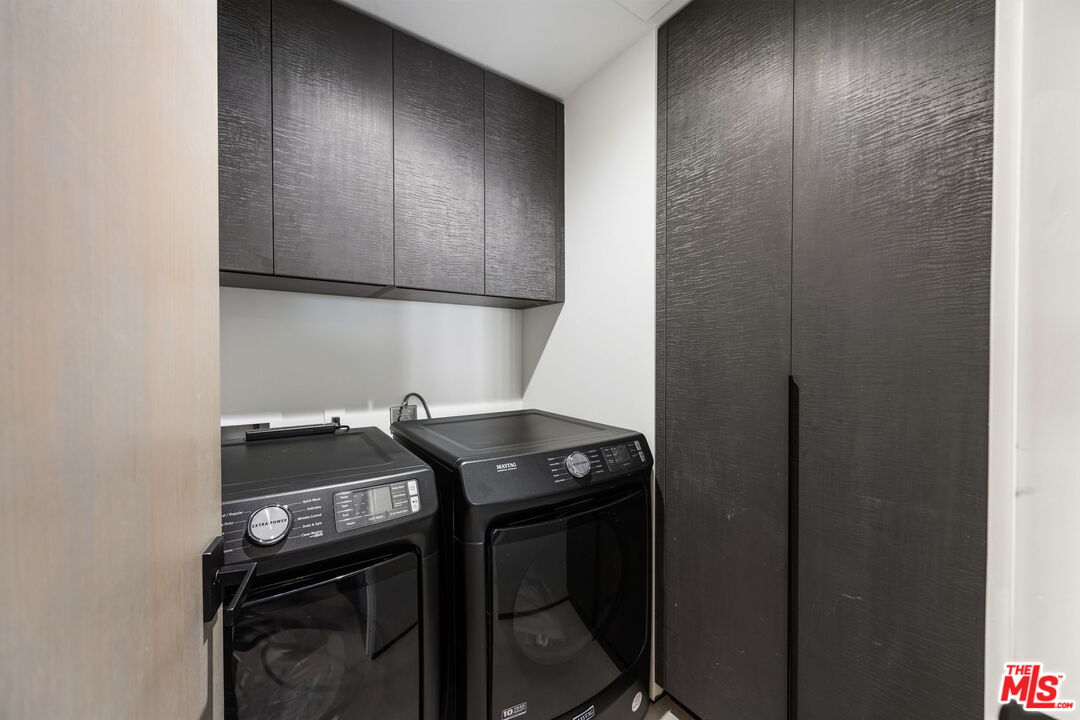 10350 Wilshire Boulevard, Unit 1203 Los Angeles, CA 90024 - Photo 39 of 69 a kitchen with a stove and a cabinet