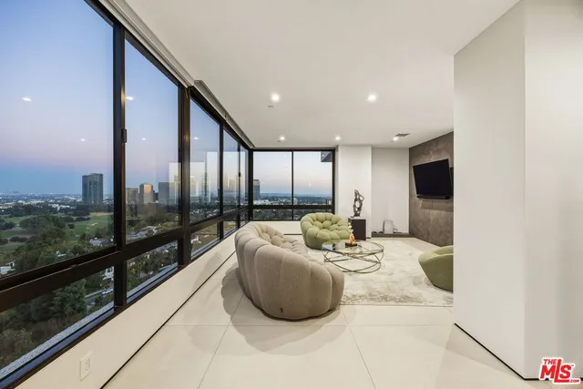 a sign broad in front of the red brick house