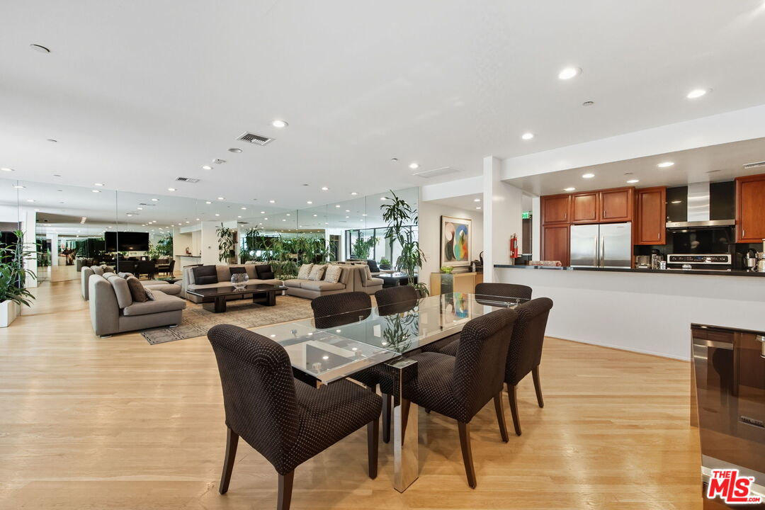 10350 Wilshire Boulevard, Unit 1203 Los Angeles, CA 90024 - Photo 47 of 69 a living room with lots of furniture and kitchen view