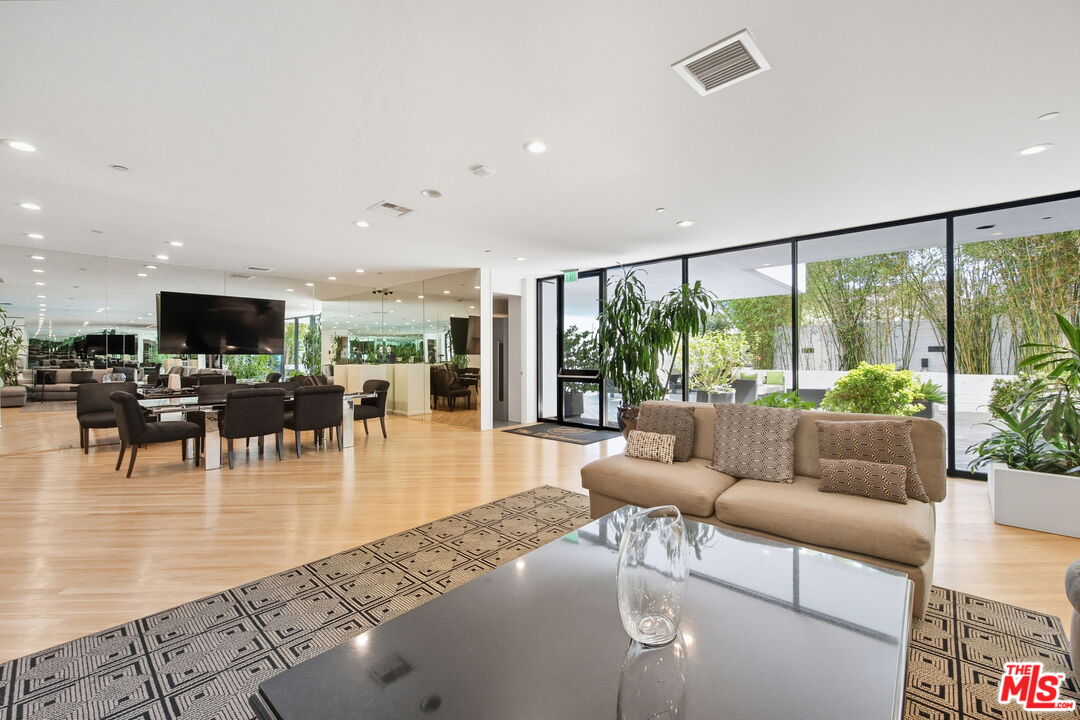 10350 Wilshire Boulevard, Unit 1203 Los Angeles, CA 90024 - Photo 48 of 69 a living room with furniture and a large window