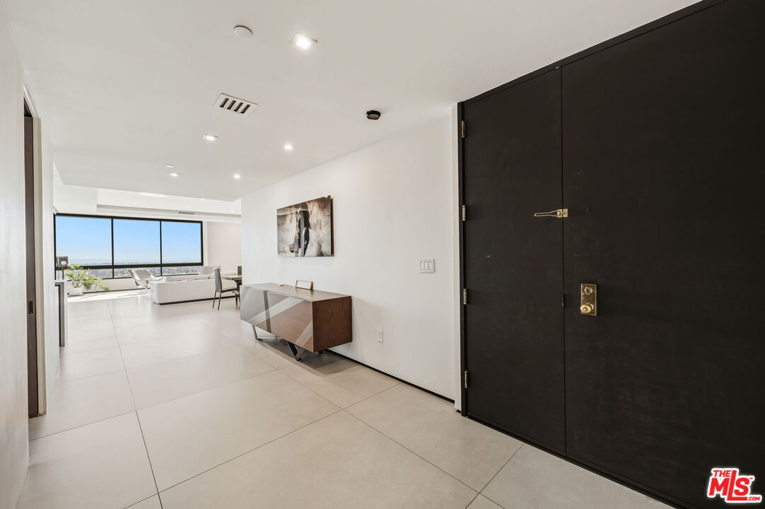 10350 Wilshire Boulevard, Unit 1203 Los Angeles, CA 90024 - Photo 5 of 69 a view of kitchen with refrigerator and window