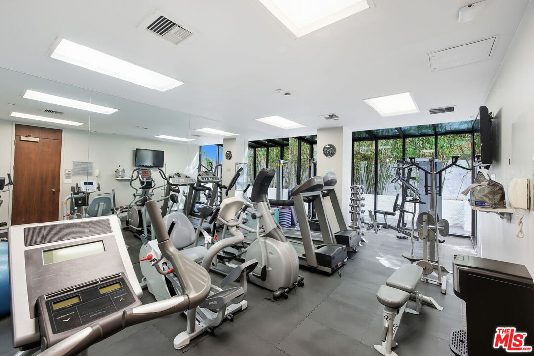 10350 Wilshire Boulevard, Unit 1203 Los Angeles, CA 90024 - Photo 51 of 69 a view of a room with gym equipment