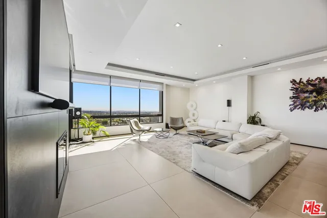 a view of a chairs and table on a balcony
