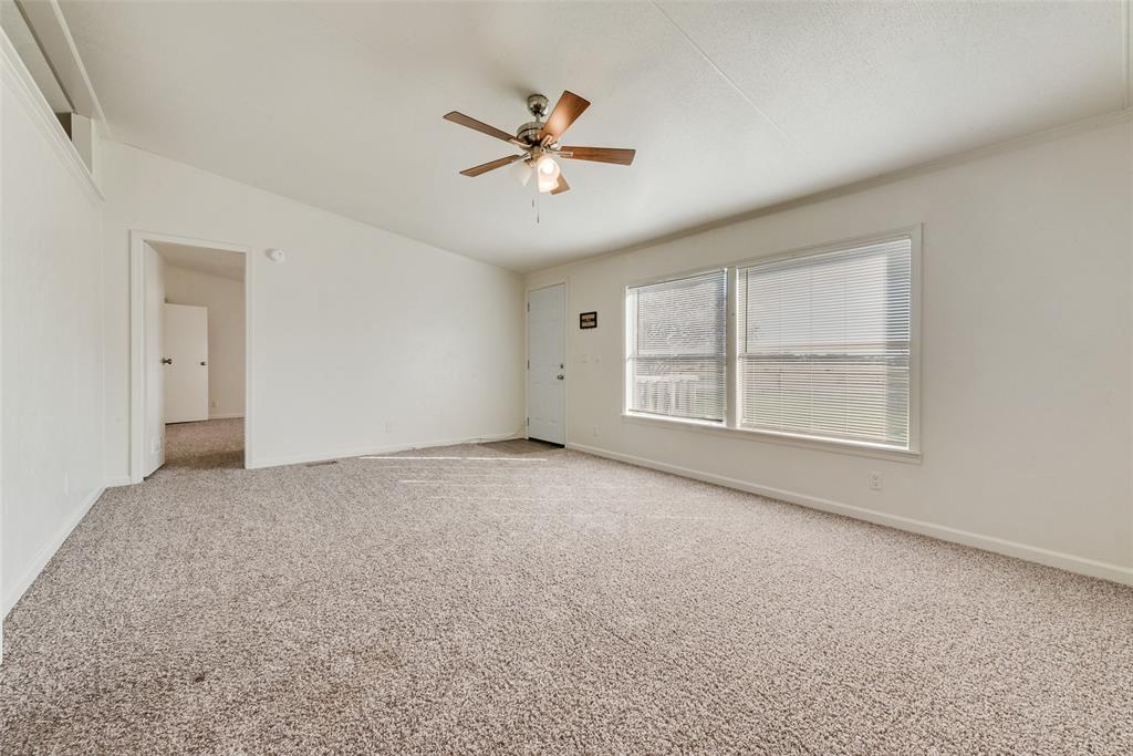 817 Kaufman Street Rosser, TX 75158 - Photo 6 of 29 Carpeted spare room with baseboards and ceiling fan