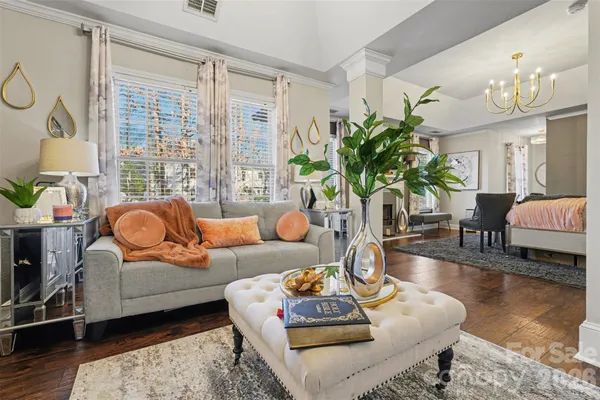 a living room with furniture and a large window