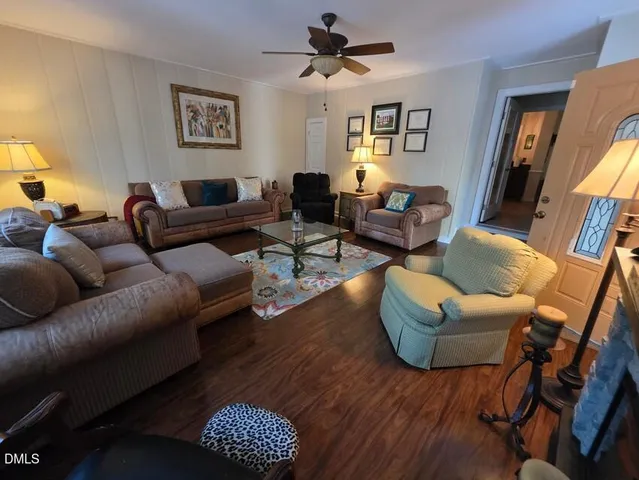 a living room with furniture rug and window
