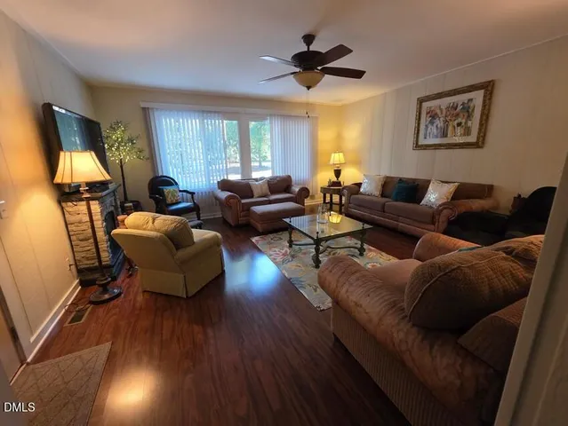 a living room with furniture and a window