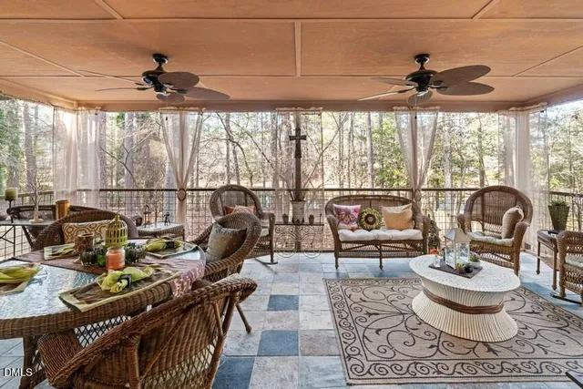 a spacious bedroom with a bed and a flat screen tv