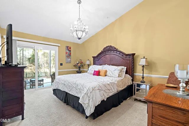 a bathroom with a granite countertop sink a toilet and a mirror