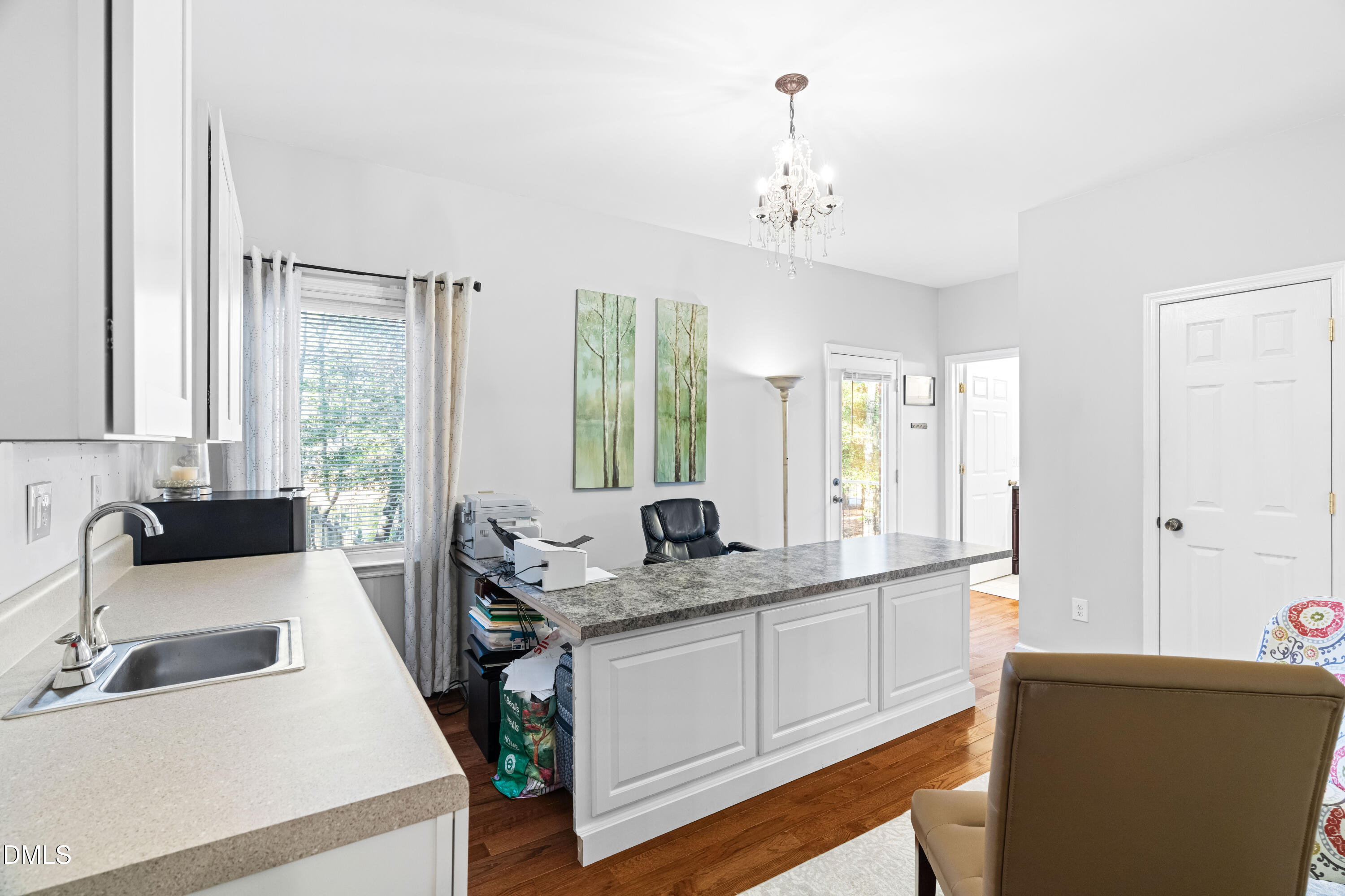 335 Sprunt Drive Clinton, NC 28328 - Photo 39 of 52 a kitchen with a sink stove and cabinets