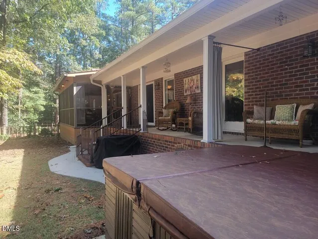 a view of a patio with table and chairs