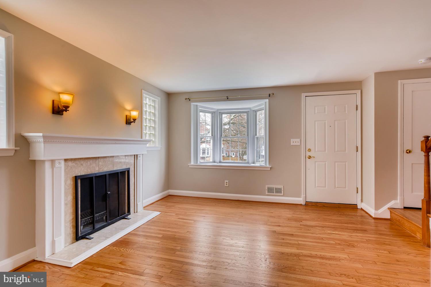 1618 Hardwick Road Baltimore, MD 21286 - Photo 5 of 27 a view of livingroom with hardwood floor fireplace and window